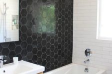 24 black honeycomb tiles on the wall