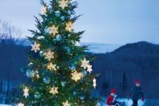 24 outdoor Christmas tree with light snowflakes and oversized blue ornaments
