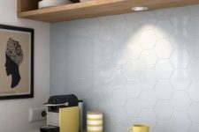 25 pale blue hex tiles contrast with warm wood furniture