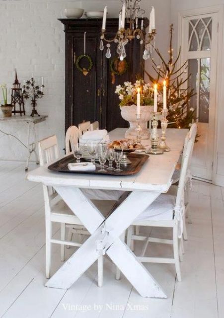 whitewashed picnic table and chairs, a contrasting black wardrobe