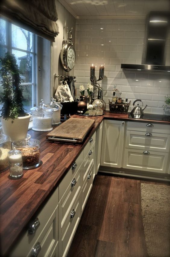 wooden tiles echo with floors, looks great with subway tiles backsplash and add warmth to the kitchen