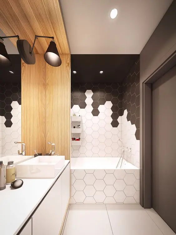 black and white honeycomb tile mosaics in the bathtub zone