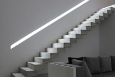 27 lit up handrail in a concrete wall for a minimal look