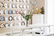 27 white picnic furniture and colorful platters on the wall