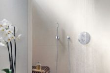28 spa-like walk-in shower clad with wood and with a rainshower