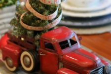 29 old car with a small Christmas tree for decor