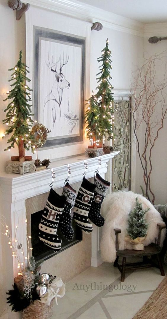 black and white stockings and lit up small trees on the mantel