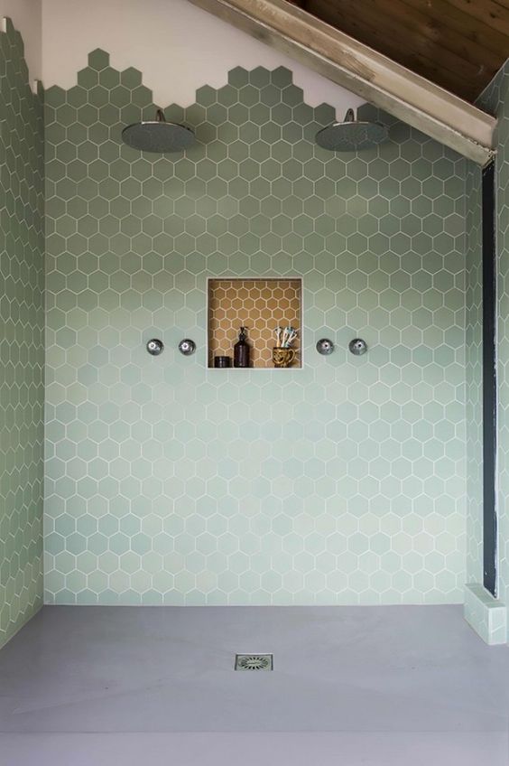 green shower hexagonal tiles towards the ceiling