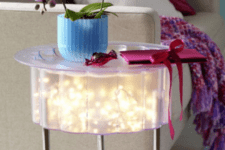 31 small IKEA table with string lights inside is totally DIYable