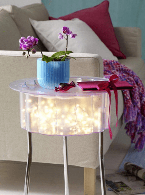small IKEA table with string lights inside is totally DIYable