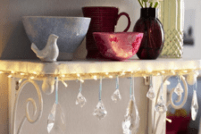 32 attach string lights and crystals to a small shelf