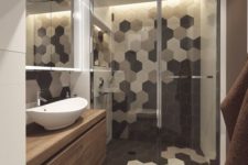 33 shower area with black, grey and white hex tile mosaic