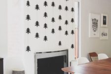 33 statement fireplace wall with black trees over it