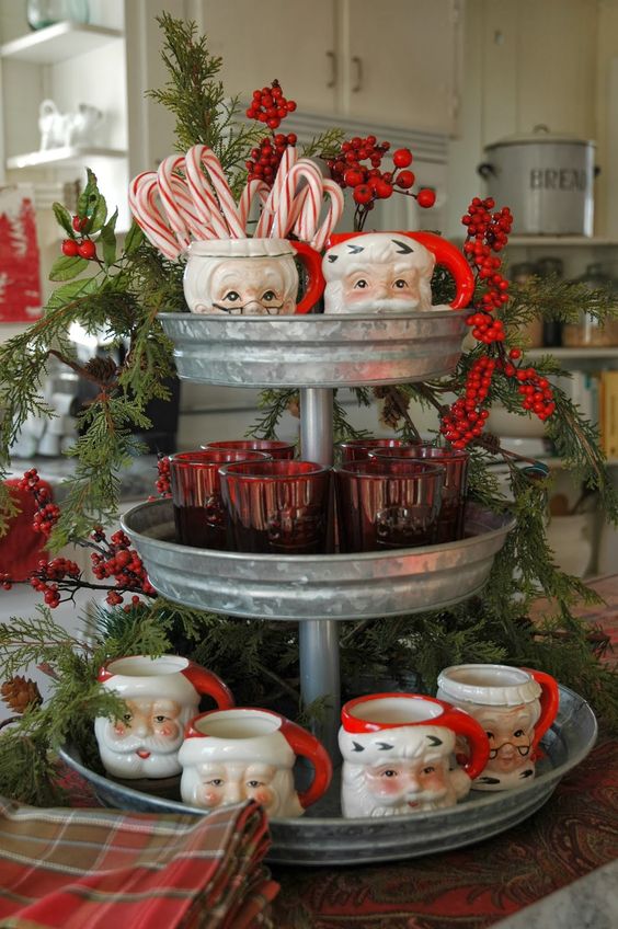 vintage Santa mugs on a galvanized cupcake stand