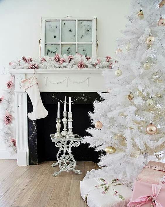 shabby chic living room with pink pinecones, white evergreens and gold ornaments