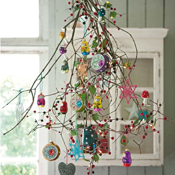 branches with colorful ornaments and pompoms