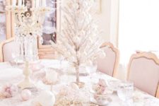 40 shabby chic table setting with a silver tabletop tree, pastel ornaments and beads