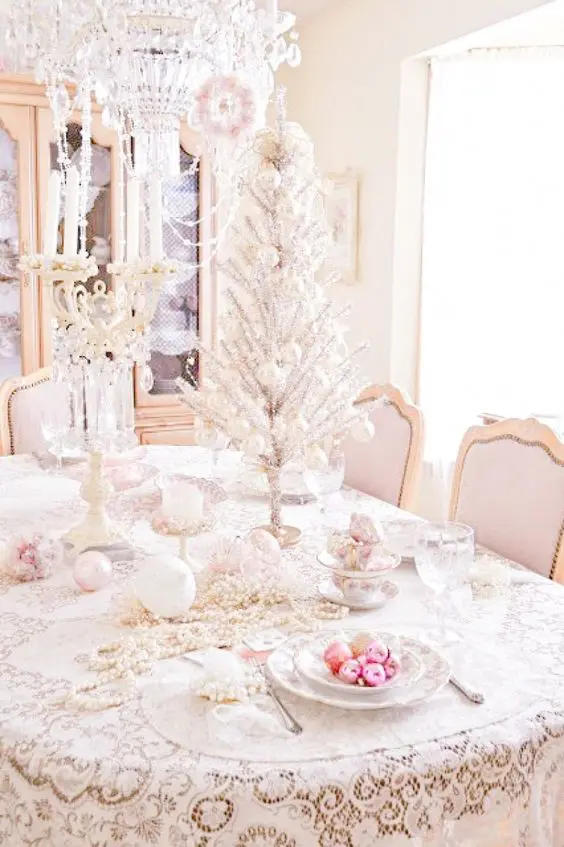 shabby chic table setting with a silver tabletop tree, pastel ornaments and beads