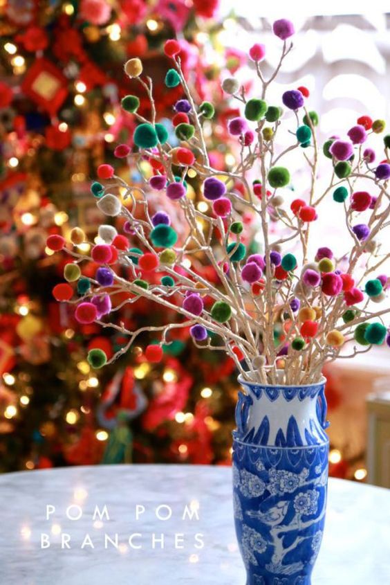 white branches with colorful pompoms