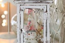 44 whitewashed lantern with a tiny bottle brush tree and a snowman inside