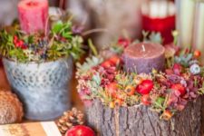 44 wooden log with a candle, flowers and berries