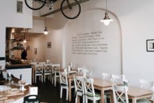 a hanging bike is a cool hipster touch to a coffee shop’s interior