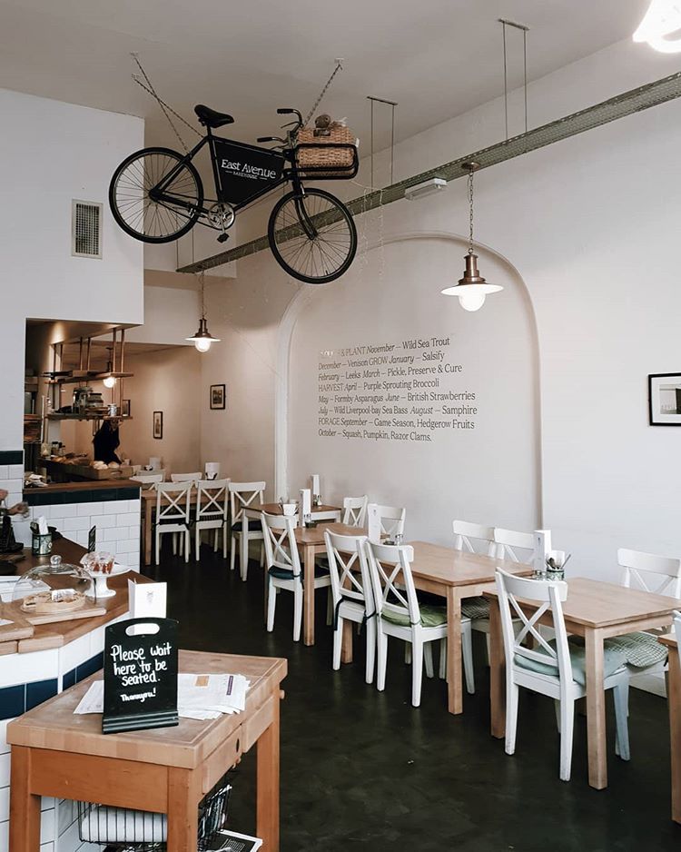 a hanging bike is a cool hipster touch to a coffee shop's interior (via @lewisombler)