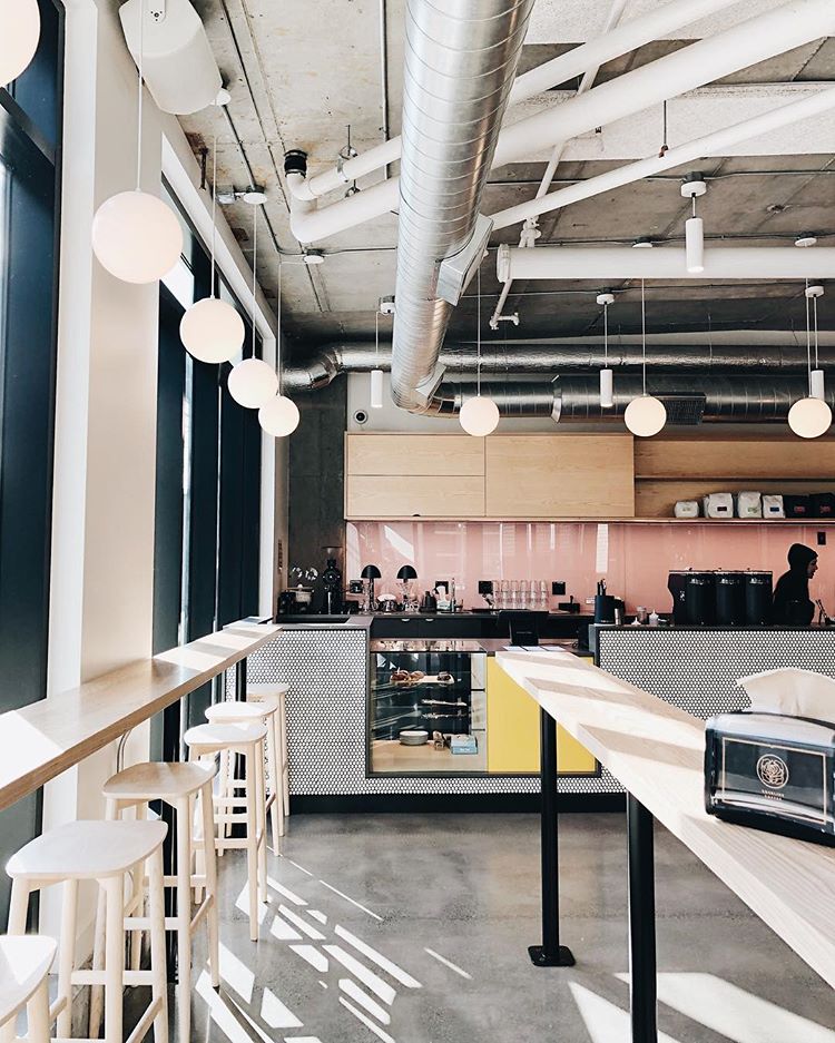 mixing industrial vent system with retro colors and elements works well for coffee shop interiors (via @marshallsteeves)