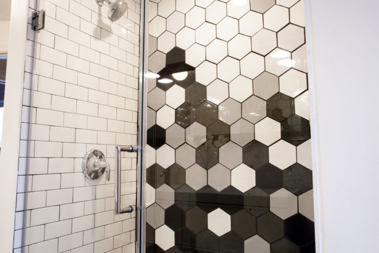 several shades of hexagonal wall tiles allows to create an unique graduation on the shower wall (Mercury Mosaics and Tile)