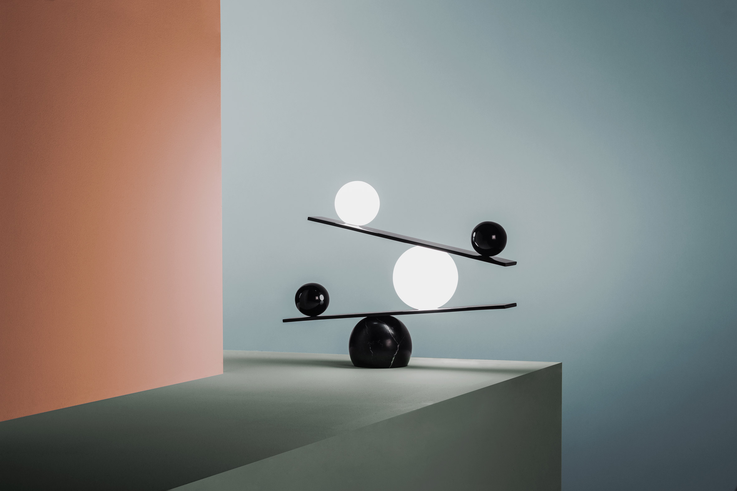 These are monochrome orb lamps put on angular shelves, all the wires hidden