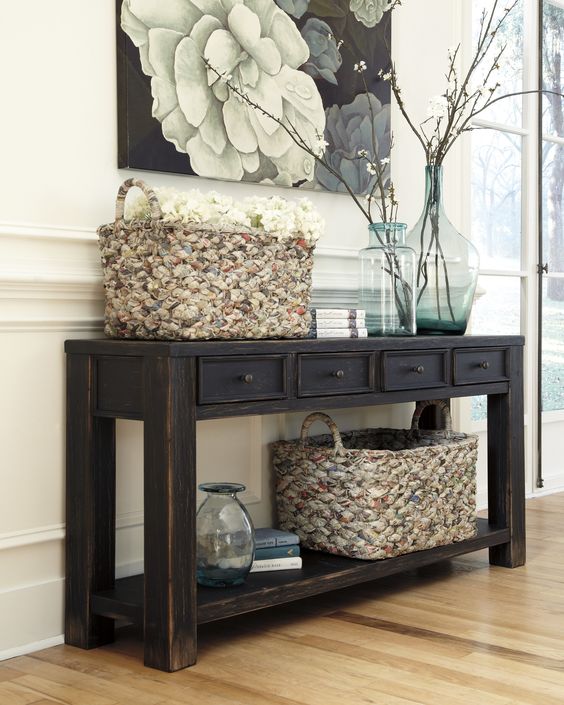 dark rustic console table with drawers and a shelf