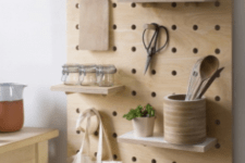 03 light-colored wooden pegboard with shelves will fit a modern or minimalist kitchen