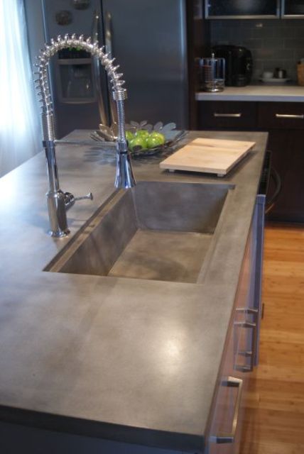 sink and countertop of a piece of concrete for the kitchen