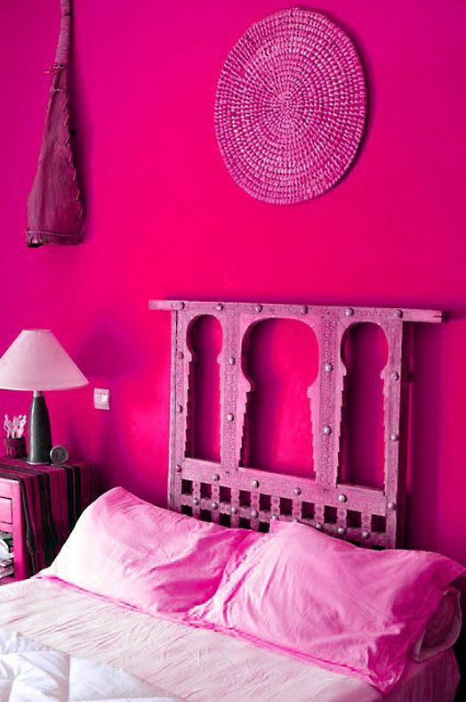 vibrant Morocco-inspired bedroom with hot pink walls and all the rest pink