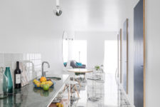 04 The kitchen is a simple open space wwith marble and stone surfaces as such a look is more airy