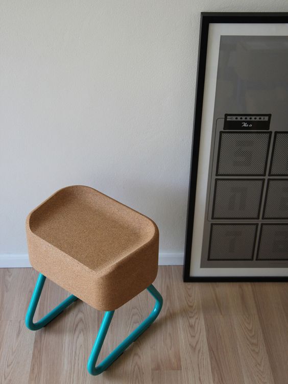 a cork seat and bold turquoise framing contrast to create a modern flavor