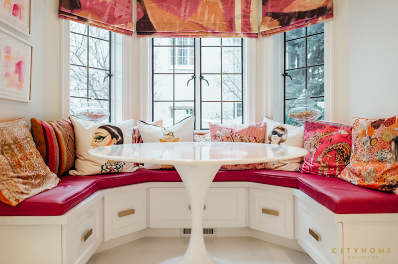 This is a breakfast nook done in hot pink and other bold colors