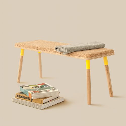 a cork seat and wooden legs with a neon yellow accent