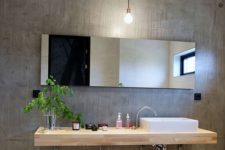 05 concrete walls give this bathroom a modern and a bit industrial look