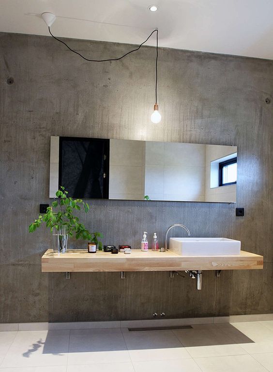 concrete walls give this bathroom a modern and a bit industrial look
