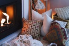 06 create your own nook by the fireplace just putting pillows and blankets there