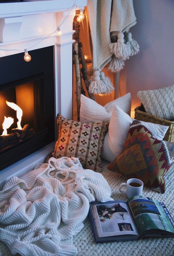 create your own nook by the fireplace just putting pillows and blankets there