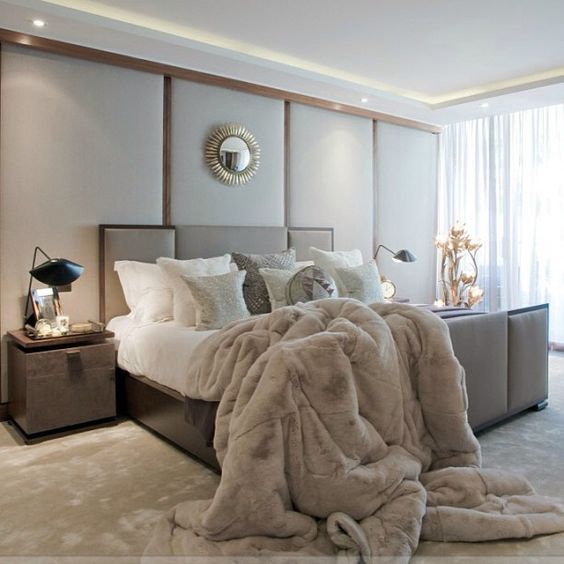 taupe bed, floor and a faux fur blanket for a cozy modern bedroom look