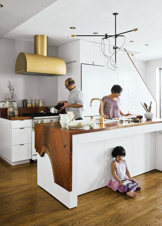 white kitchen island with a rough wood edge cover looks unusual