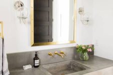 07 concrete sink and countertop look contrasting with gold touches