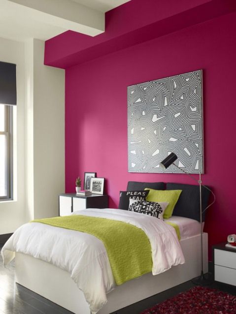 modern girlish bedroom with a fuchsia accent wall as a feminine feature