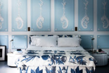 08 The bedroom strikes with an adorable shade of blue and white stucco on the walls