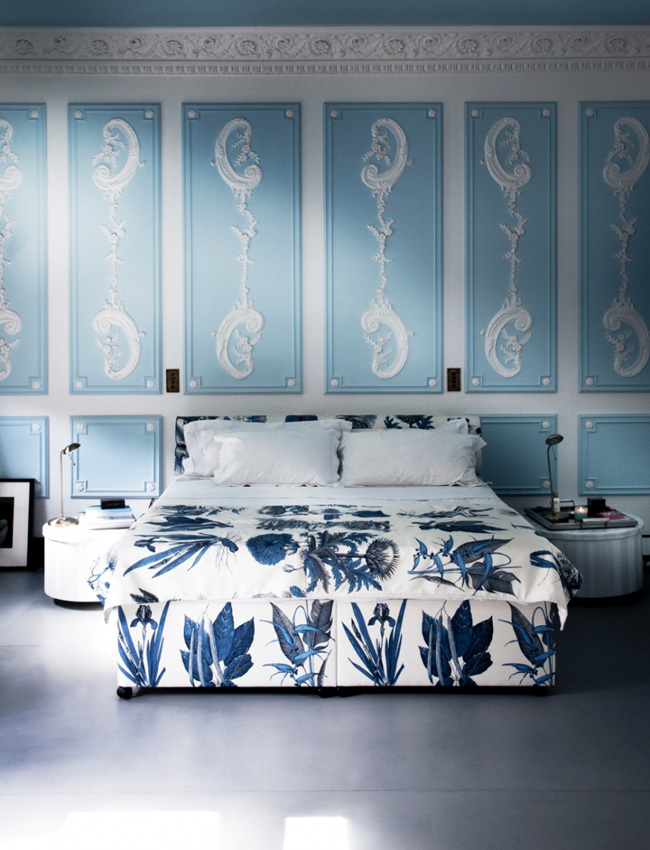The bedroom strikes with an adorable shade of blue and white stucco on the walls