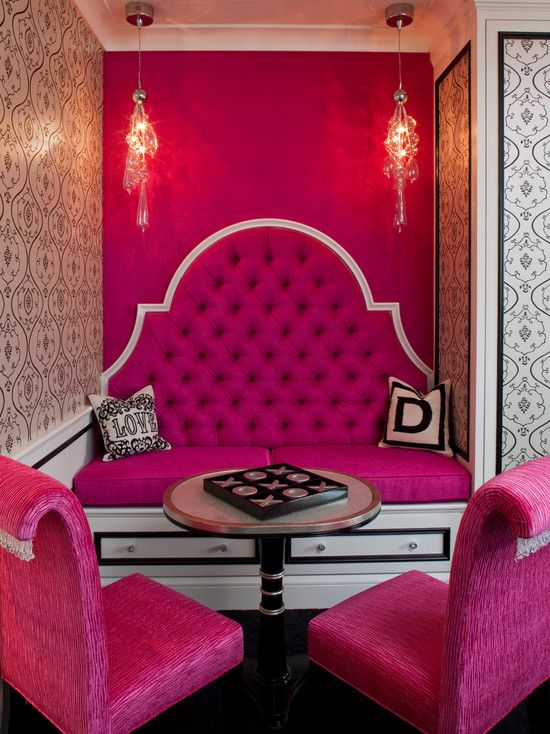 breakfast nook with a hot pink accent wall and furniture looks interesting