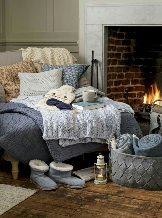 cozy daybed by the fireplace can be a perfect nook